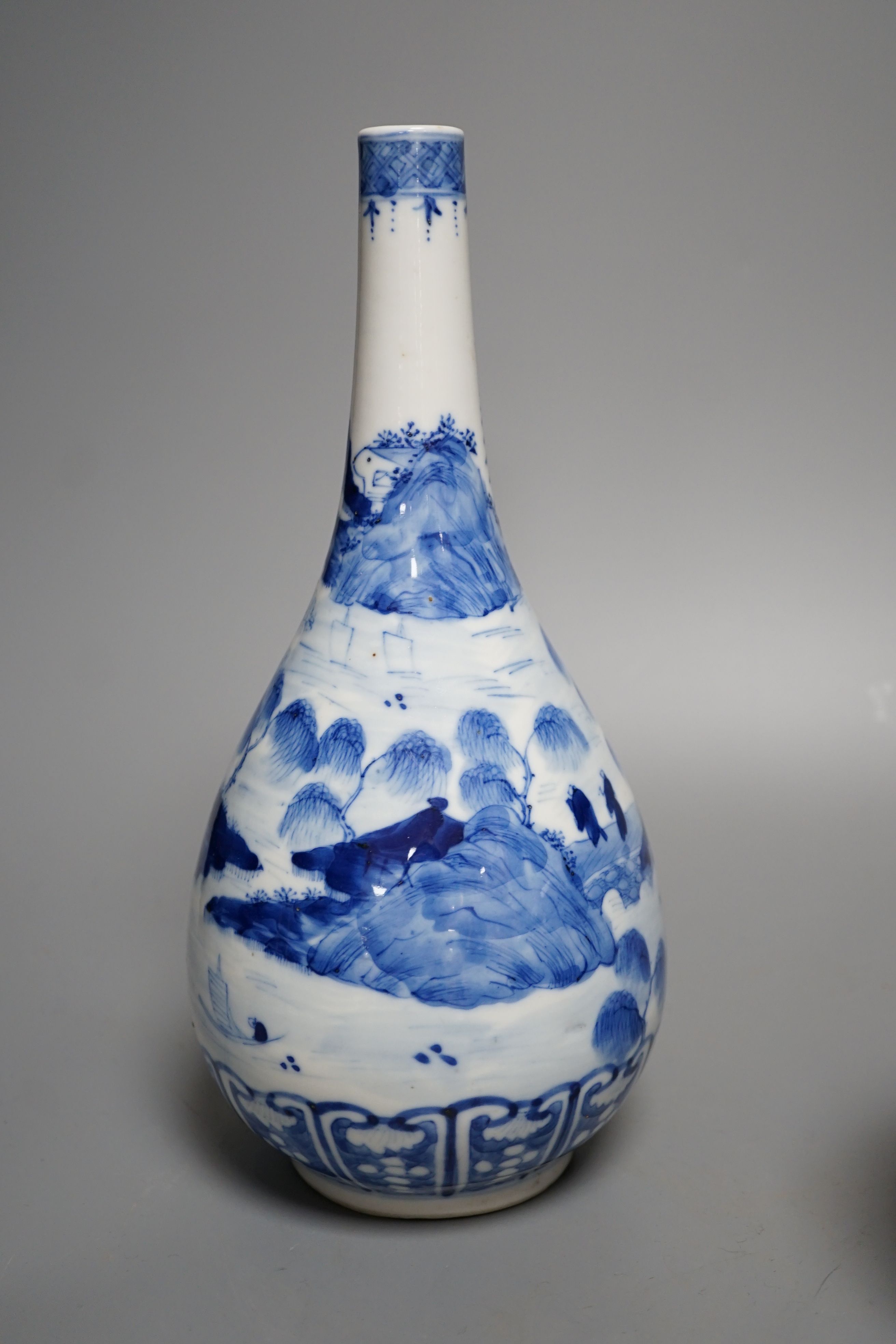 A Chinese blue and white vase and 3 graduated blue and white ginger jars, Vase25 cms high.